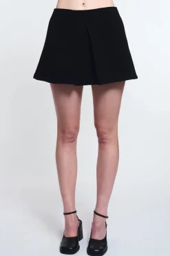 MaisonCléo Jupes>LA POUPETTE DÉFILÉ LOOK 10 – Jupe en laine noire plissée SERVANE