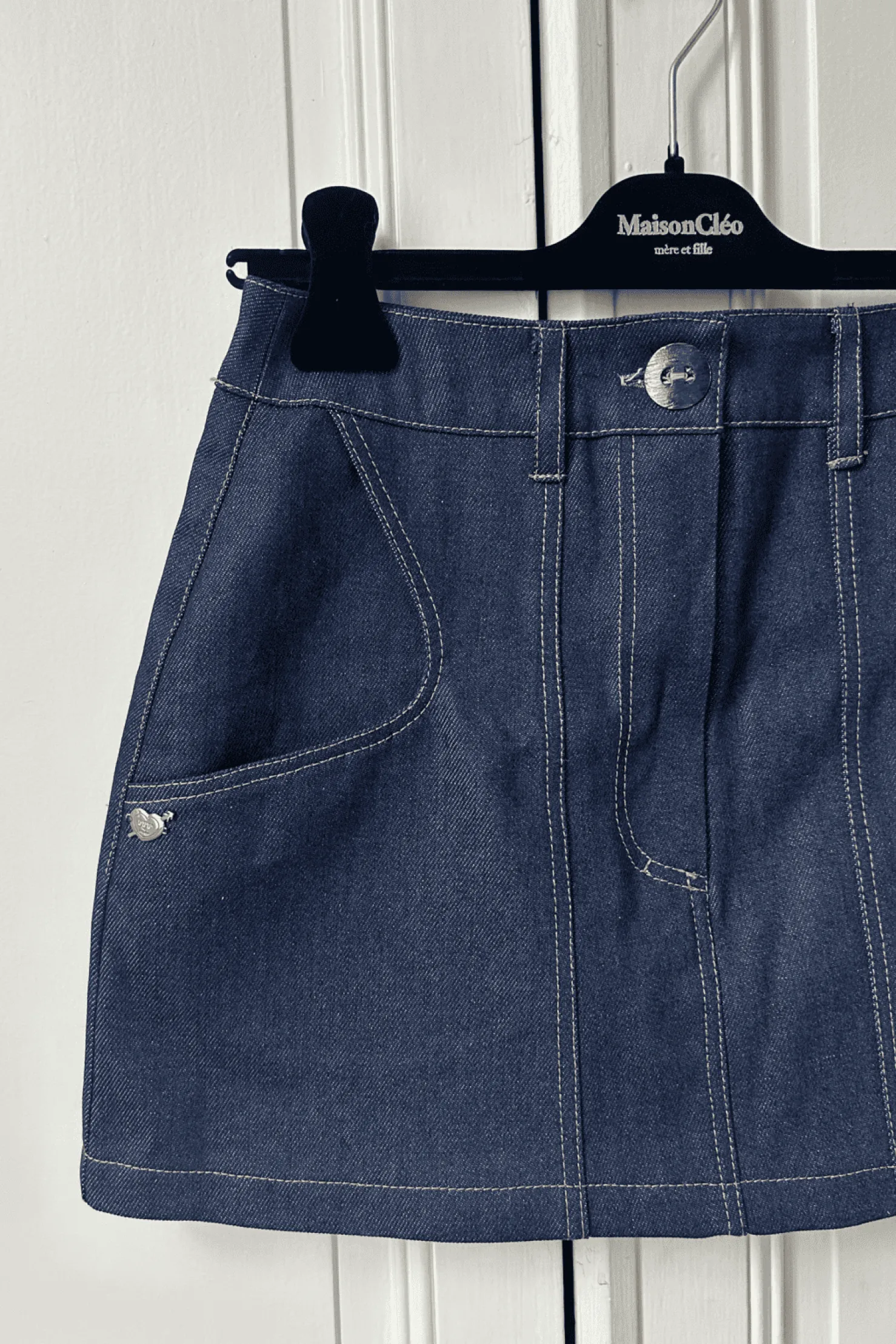 MaisonCléo Jupes>Mini jupe en coton denim avec poches arrondies
